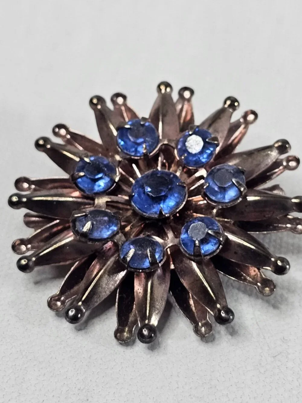 Vintage Atomic Starburst Brooch Blue Rhinestone Bronze Tone Unmarked Jewelry Pin