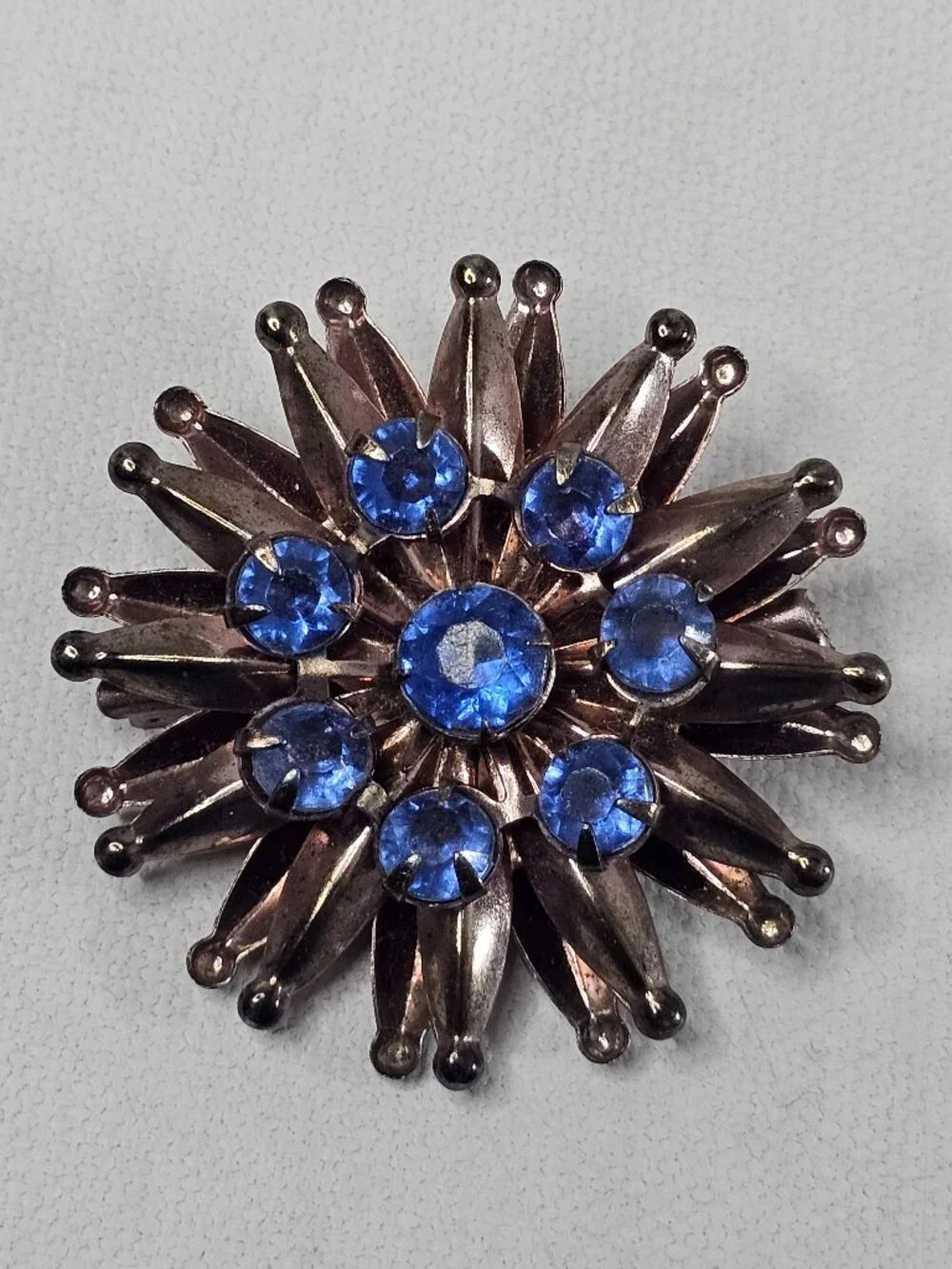 Vintage Atomic Starburst Brooch Blue Rhinestone Bronze Tone Unmarked Jewelry Pin