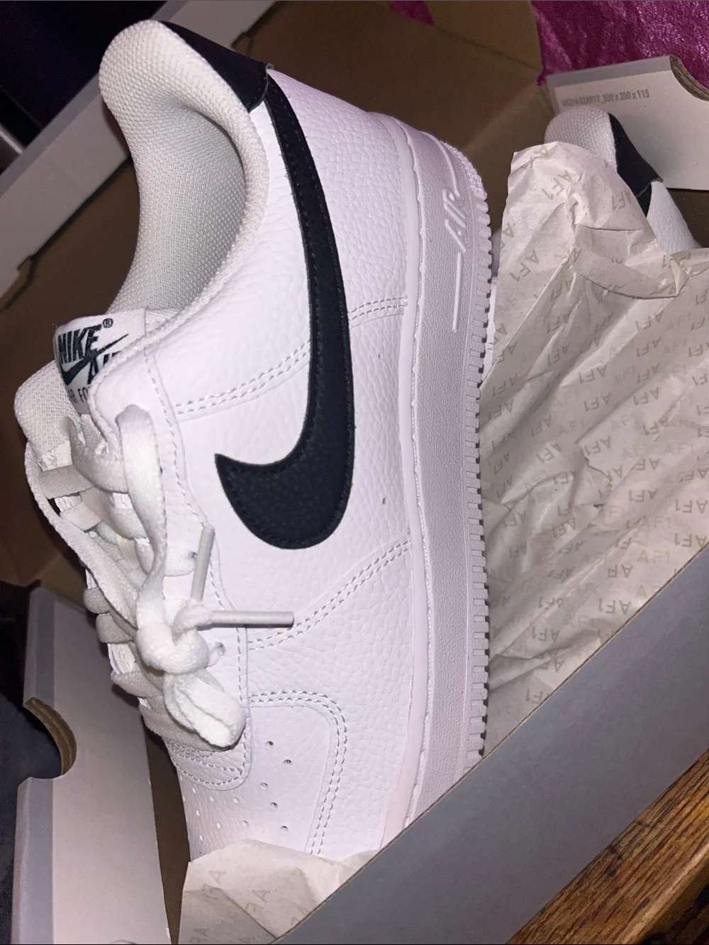 Nike White Leather Low-Top Sneakers with Black Swoosh