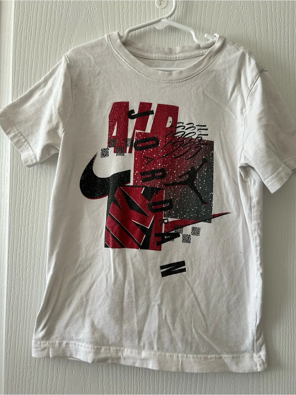 Kids Nike White Graphic Tee with Red & Black Design Small