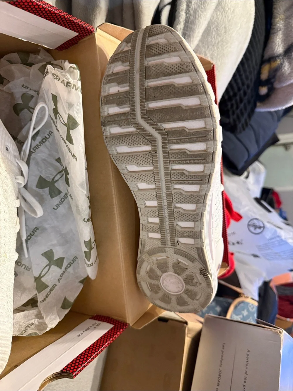 Under Armour box label in black and white with red patterned background
