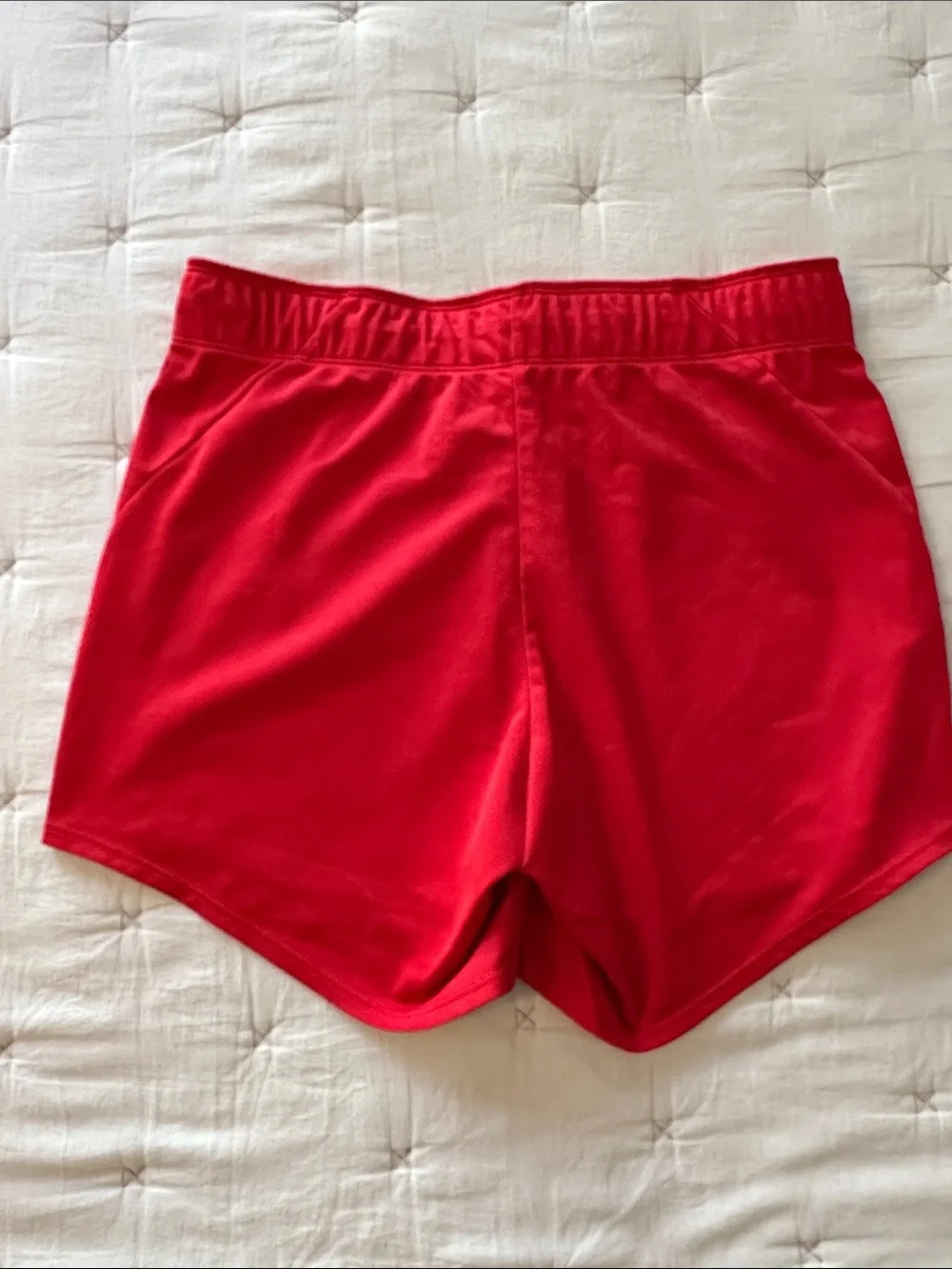 Nike Red Women's Athletic Running Shorts with peach Swoosh