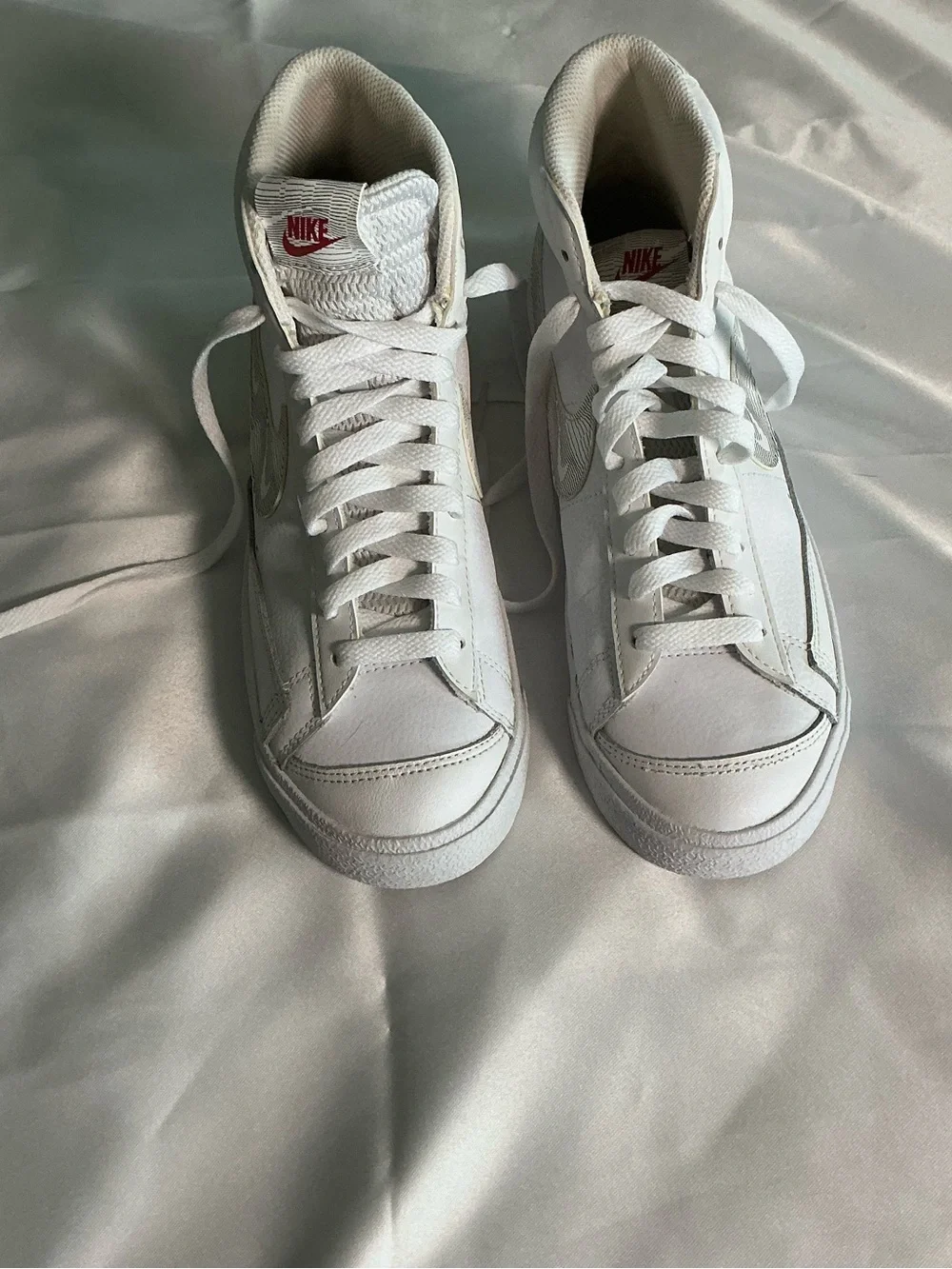 Nike White High-Top Sneakers with Red Logo