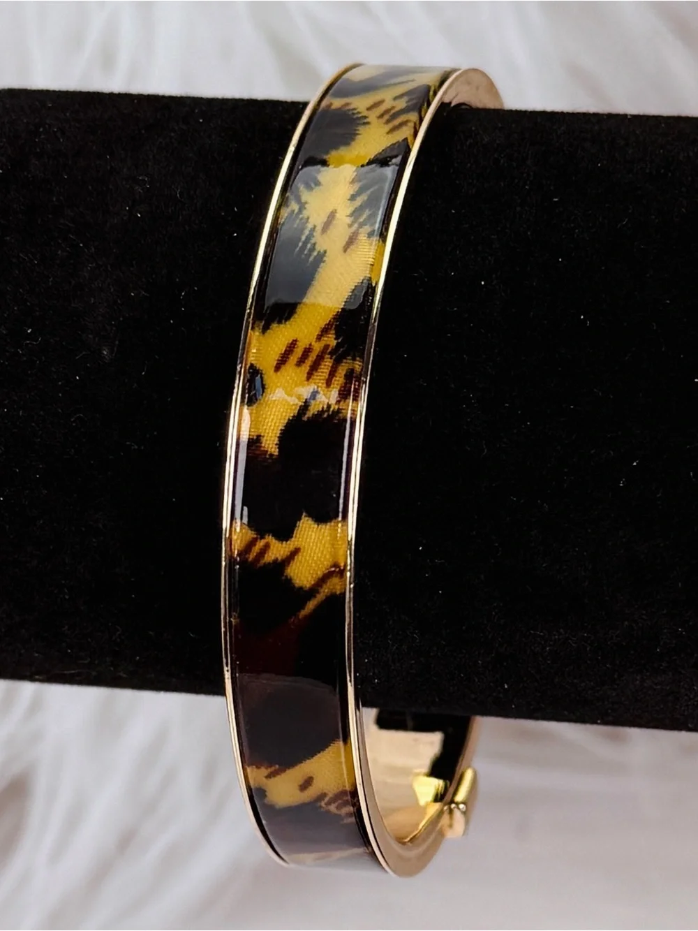 Beautiful, goldtone, animal print nine west bangle bracelet