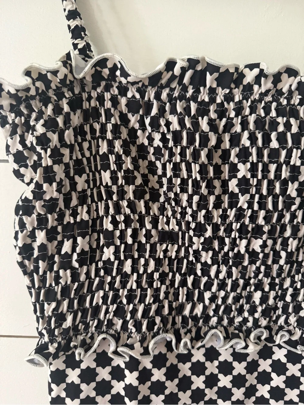 SOLID & STRIPED clothing tag
