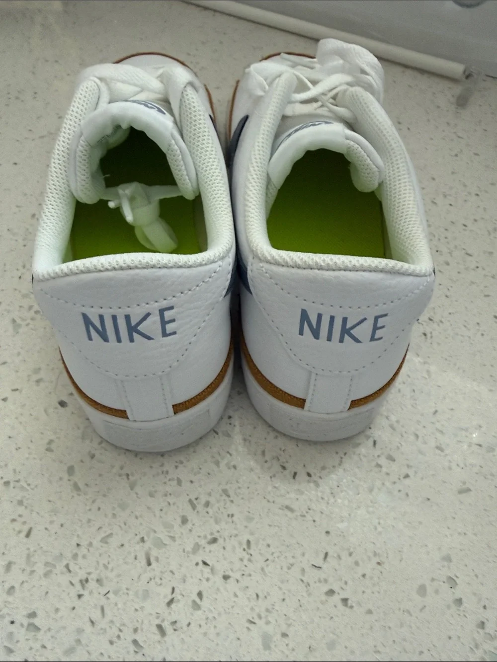 Nike Womens White Sneakers with Navy Swoosh and Tan Trim
