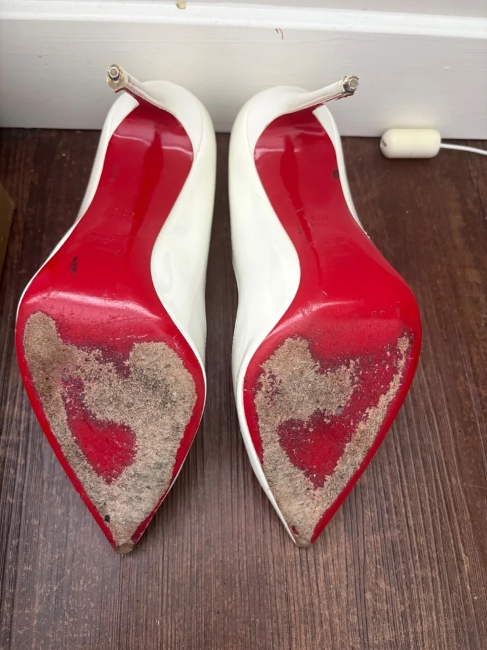 Christian Louboutin white pumps