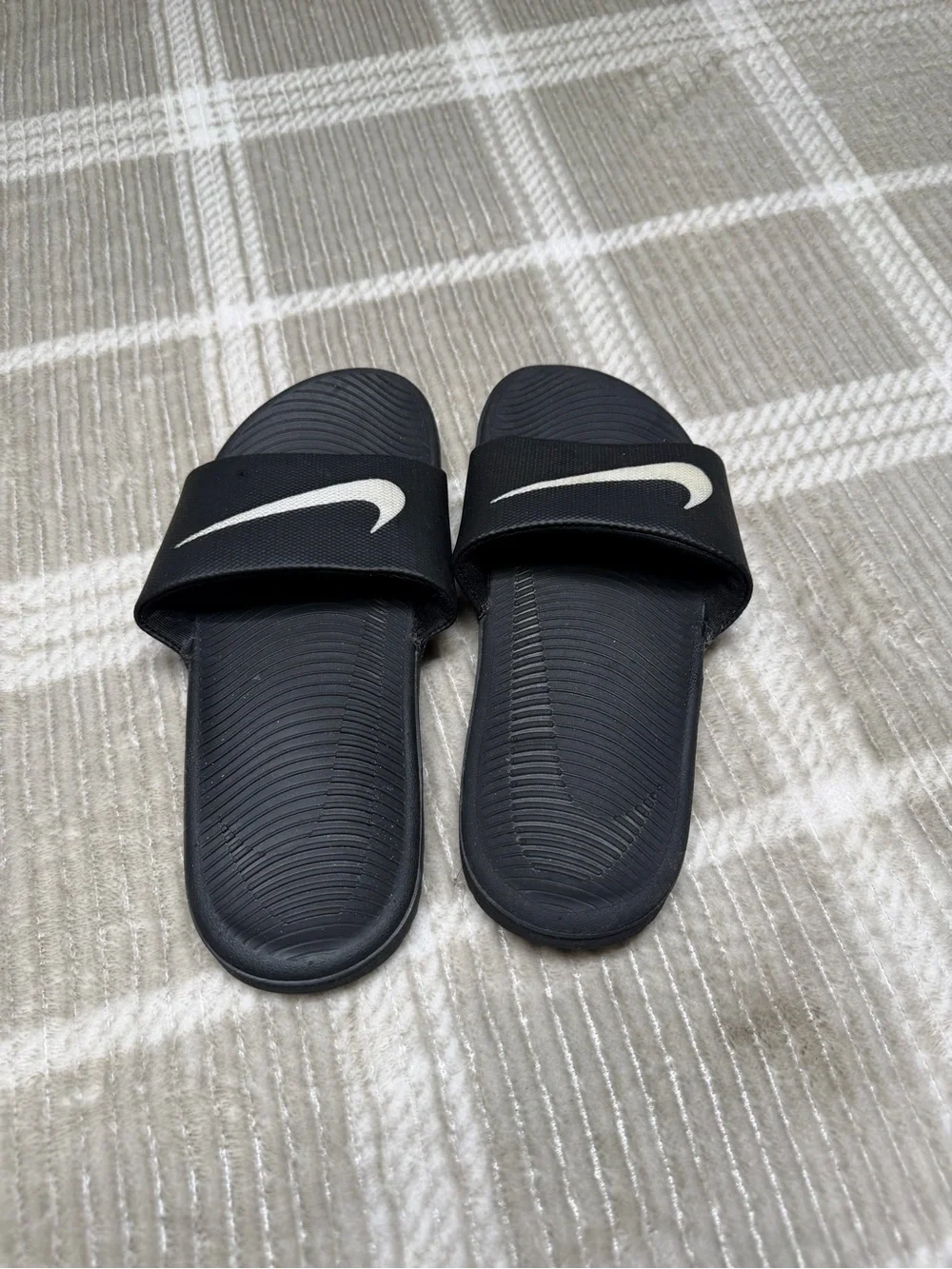 Nike Black Slides with White Swoosh Logo