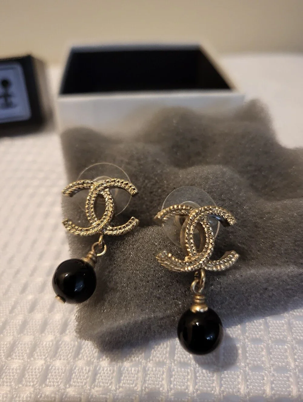 CHANEL earrings featuring