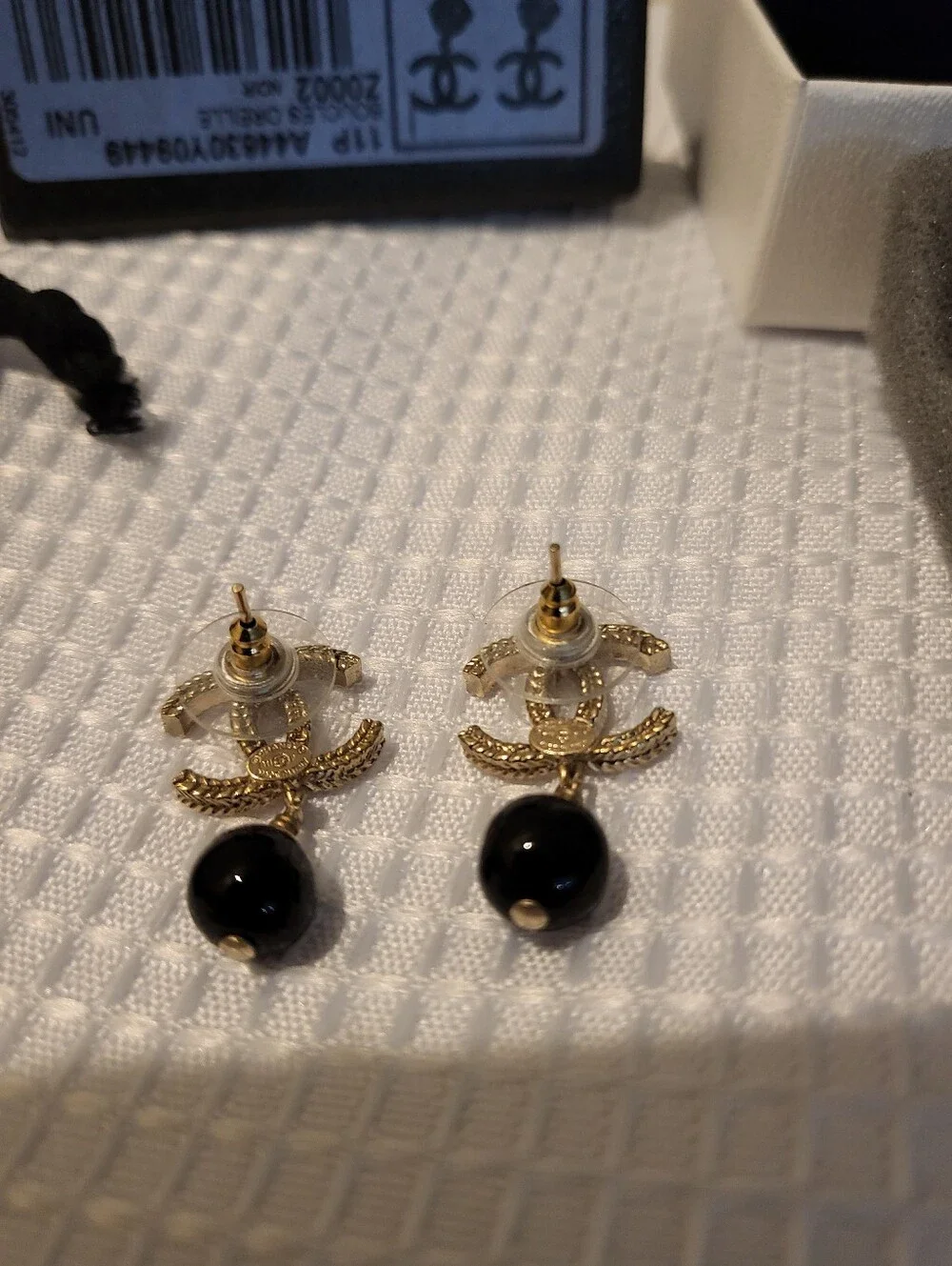 CHANEL earrings featuring