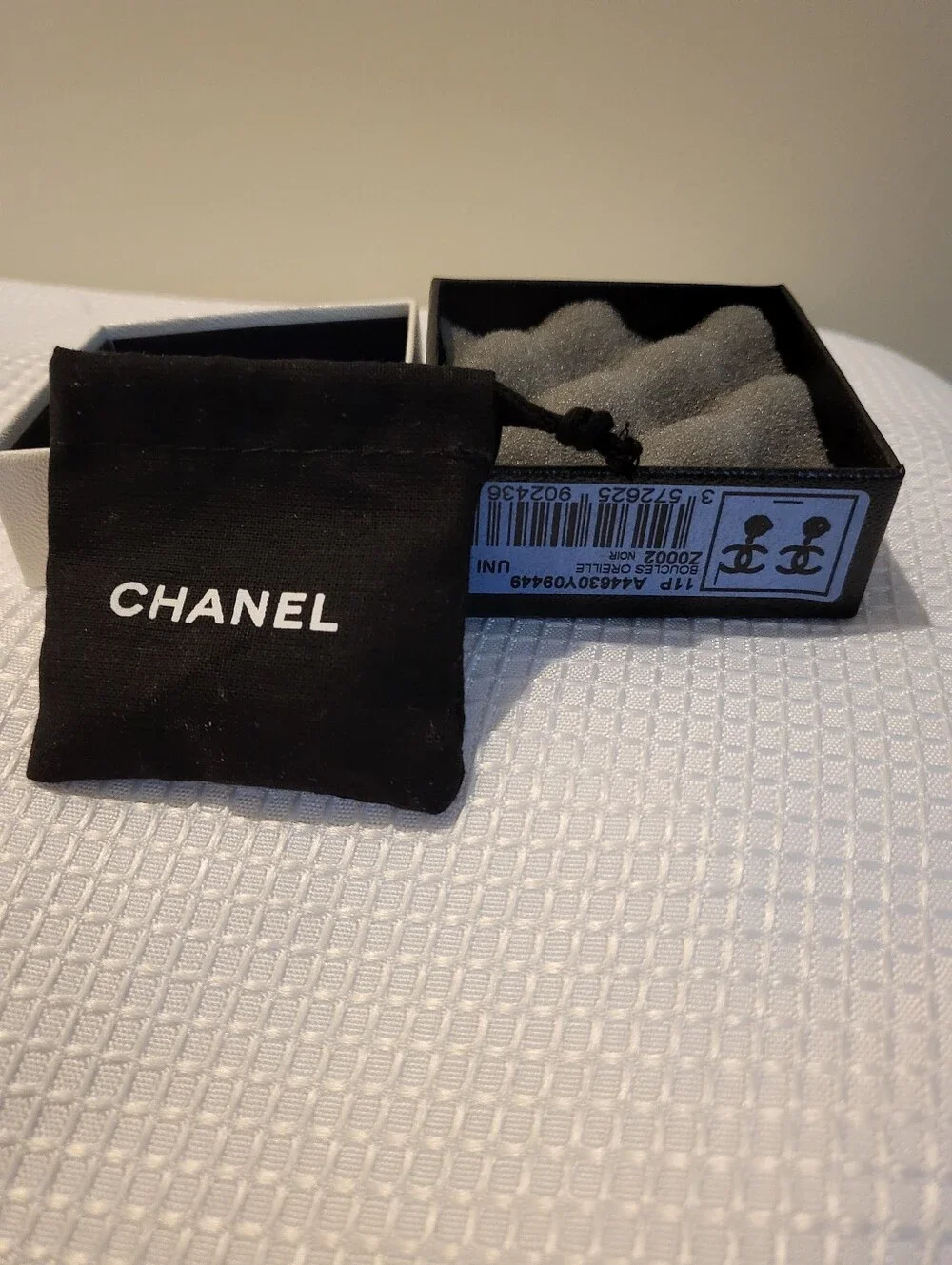 CHANEL earrings featuring