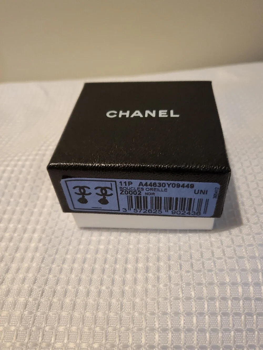 CHANEL earrings featuring