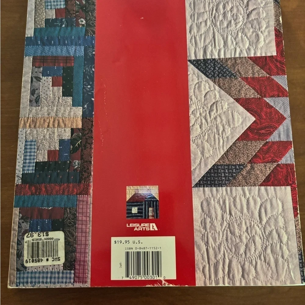 Red and Blue Log Cabin Quilt with Intricate Stitching