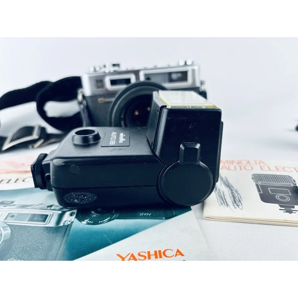 Yashica Vintage Electro 35 GSN Camera & Minolta Electroflash 28 & Film & Books