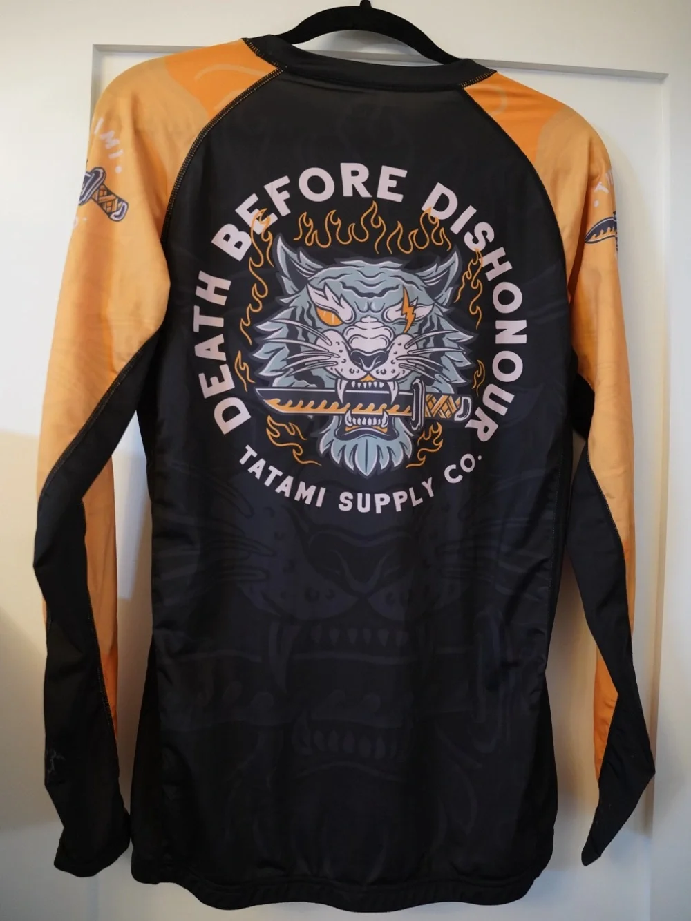 Tatami Supply Co. Men’s Black & Orange Rash Guard – Death Before Dishonour