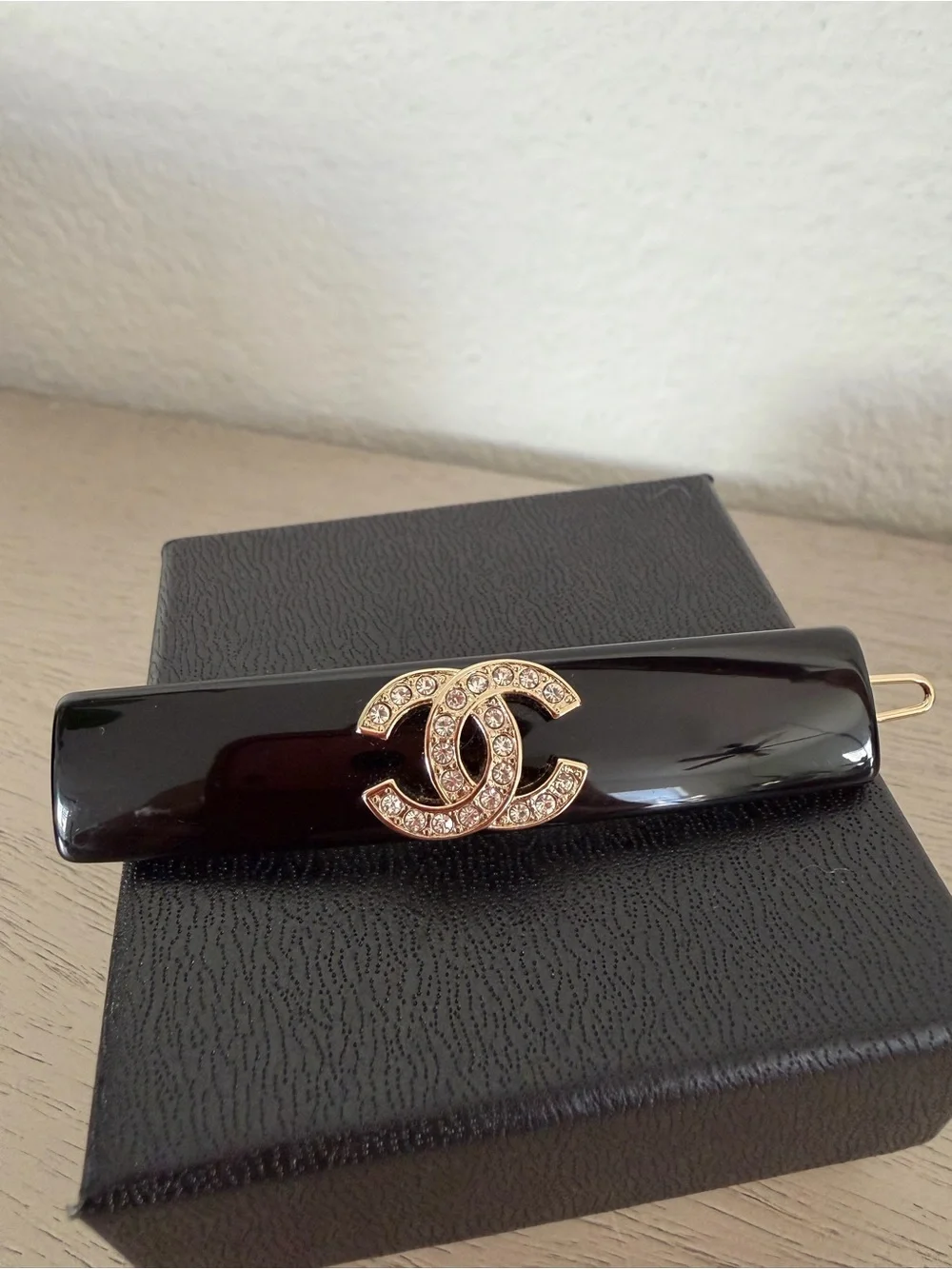CHANEL Black Resin Hair Clip with Gold Crystal CC Logo