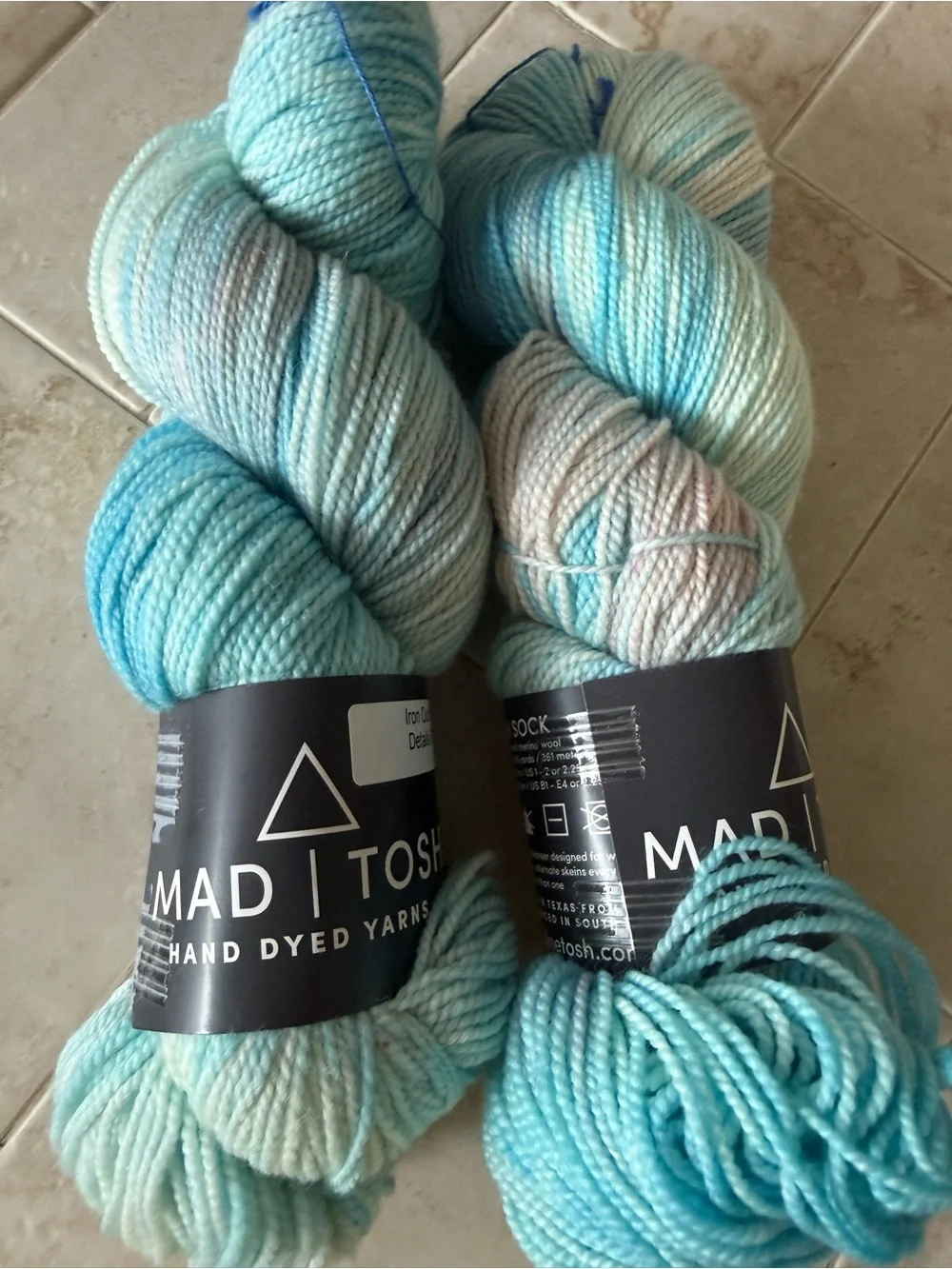 Madelinetosh Hand-Dyed Yarn Skeins in Aqua and Pale Blue