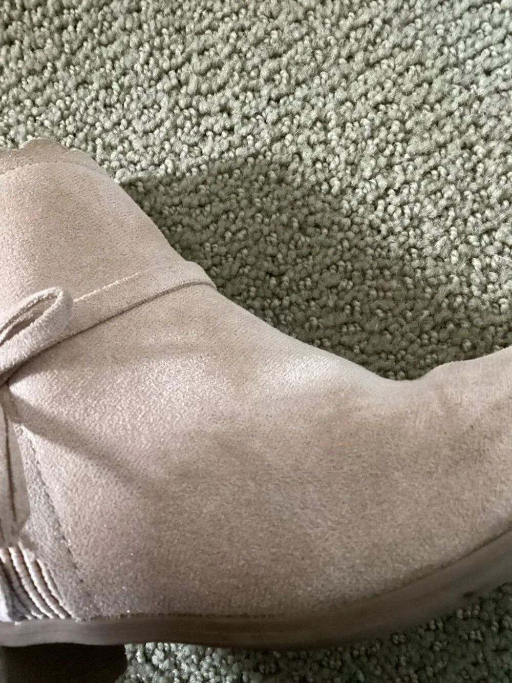 Heels for kids with bow on back of shoe.