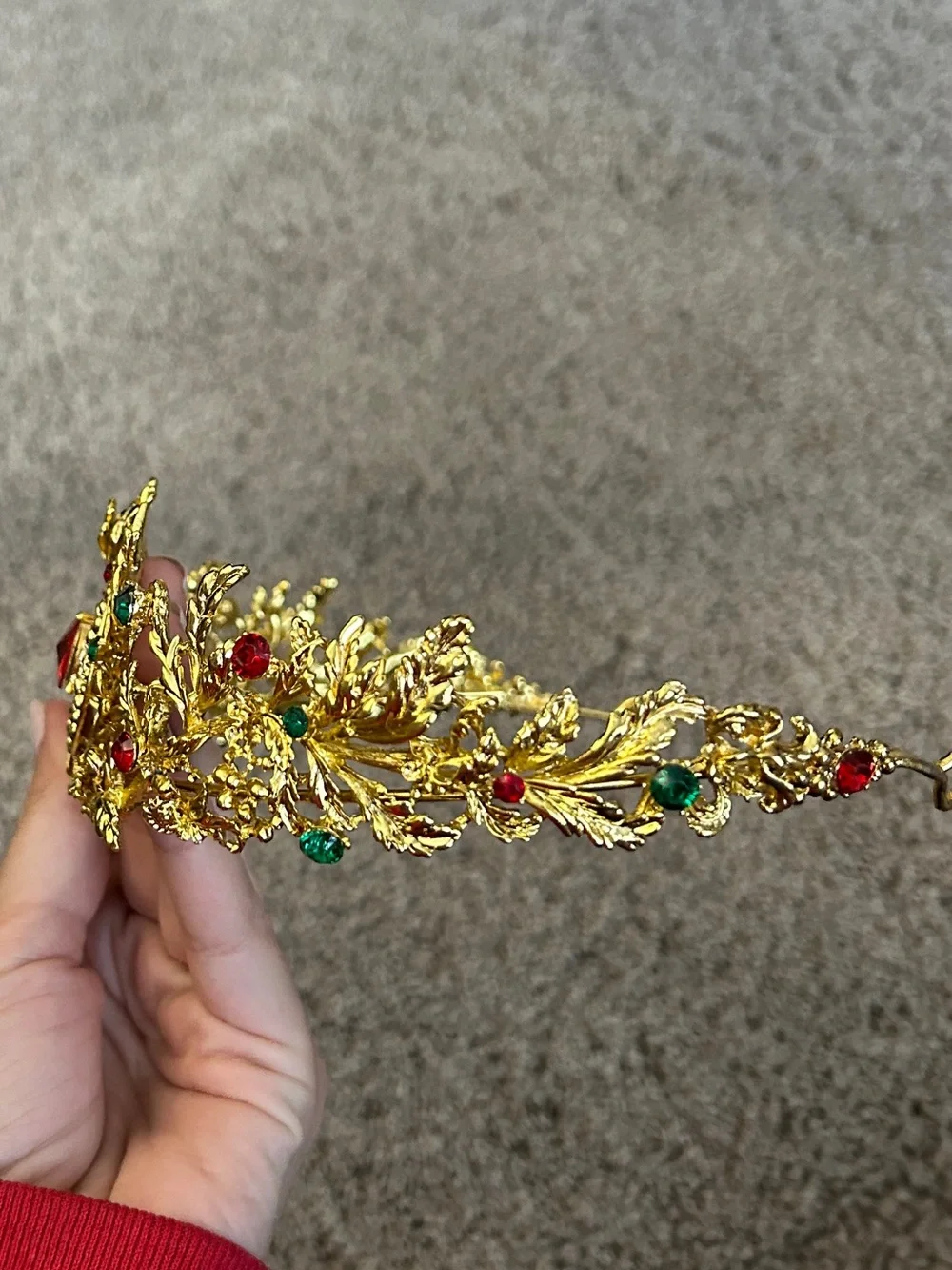 Gold colored crown headband with red and green faux gemstones