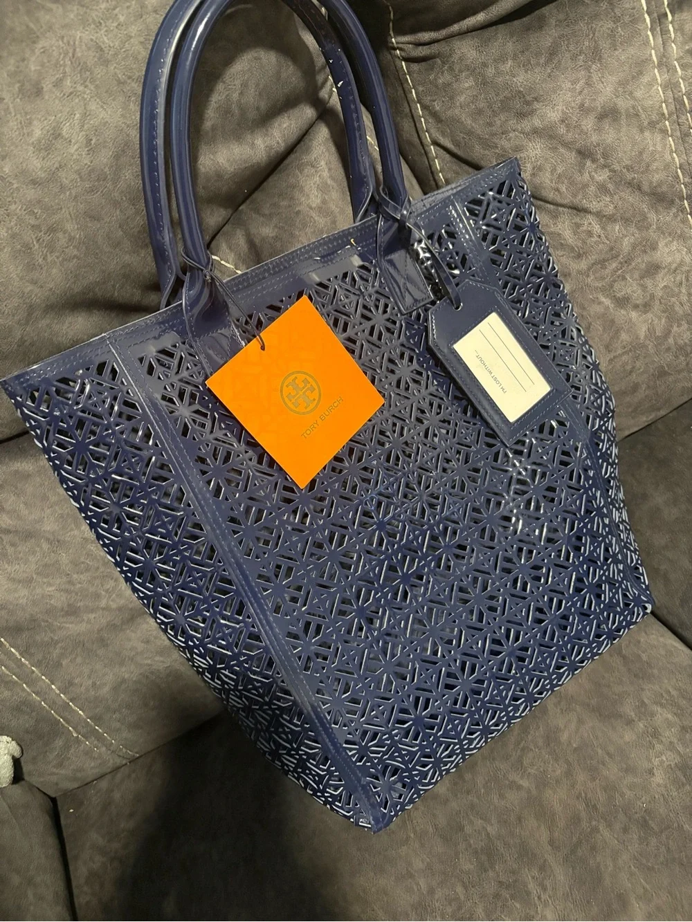 Tory Burch luggage tag carrying