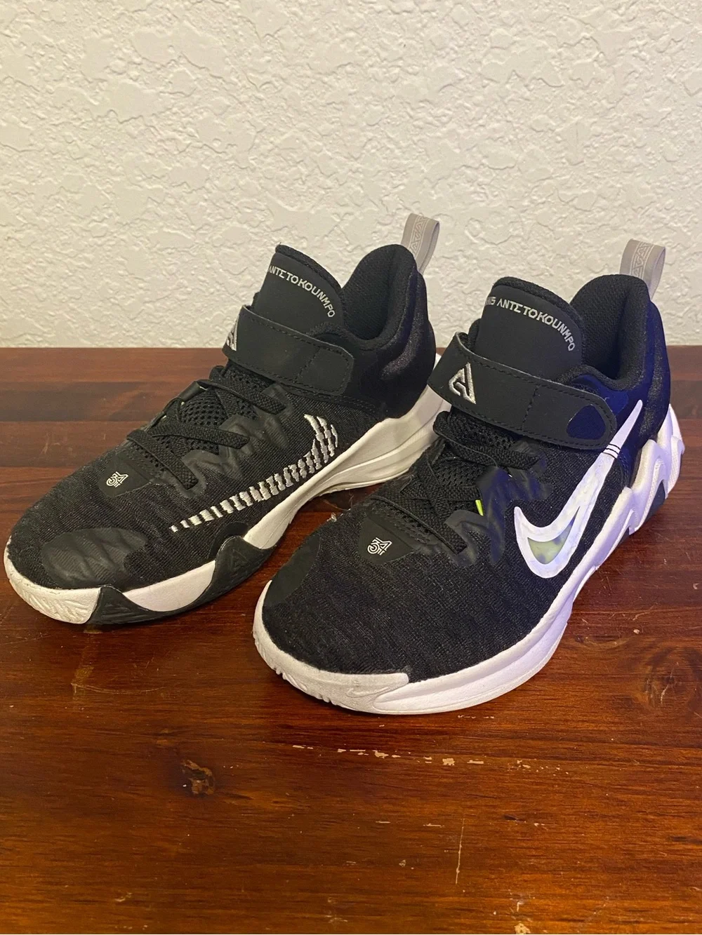Nike Kids Black Sneakers with White Soles and Lime Accent