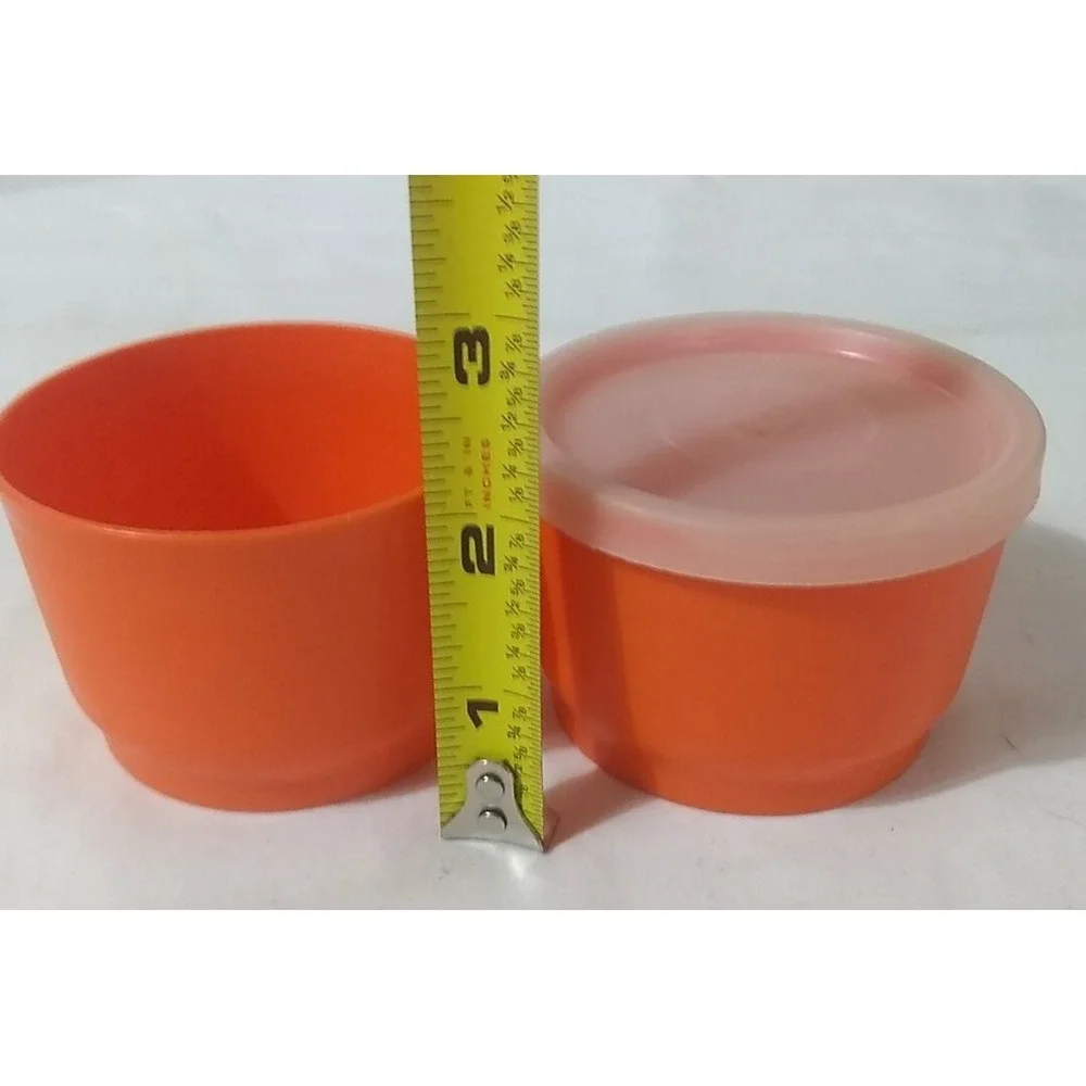Tupperware orange containers light