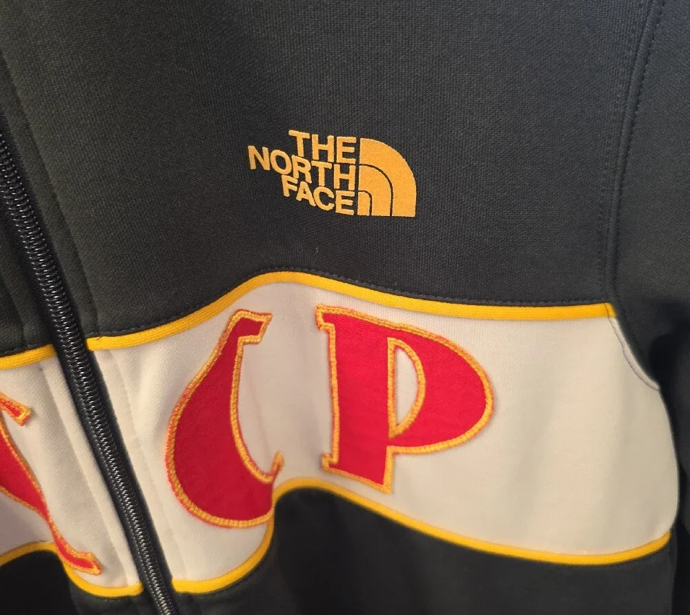 The North Face Dark Green Track Jacket with Red & Yellow Accents