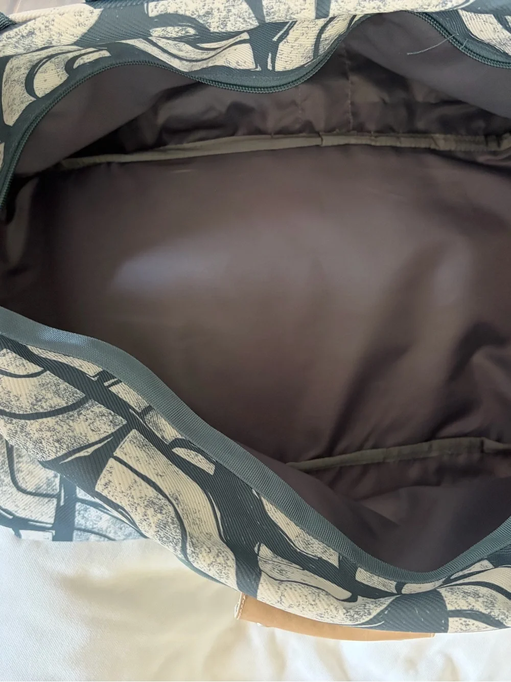 The North Face Teal and White Graphic Duffel Bag
