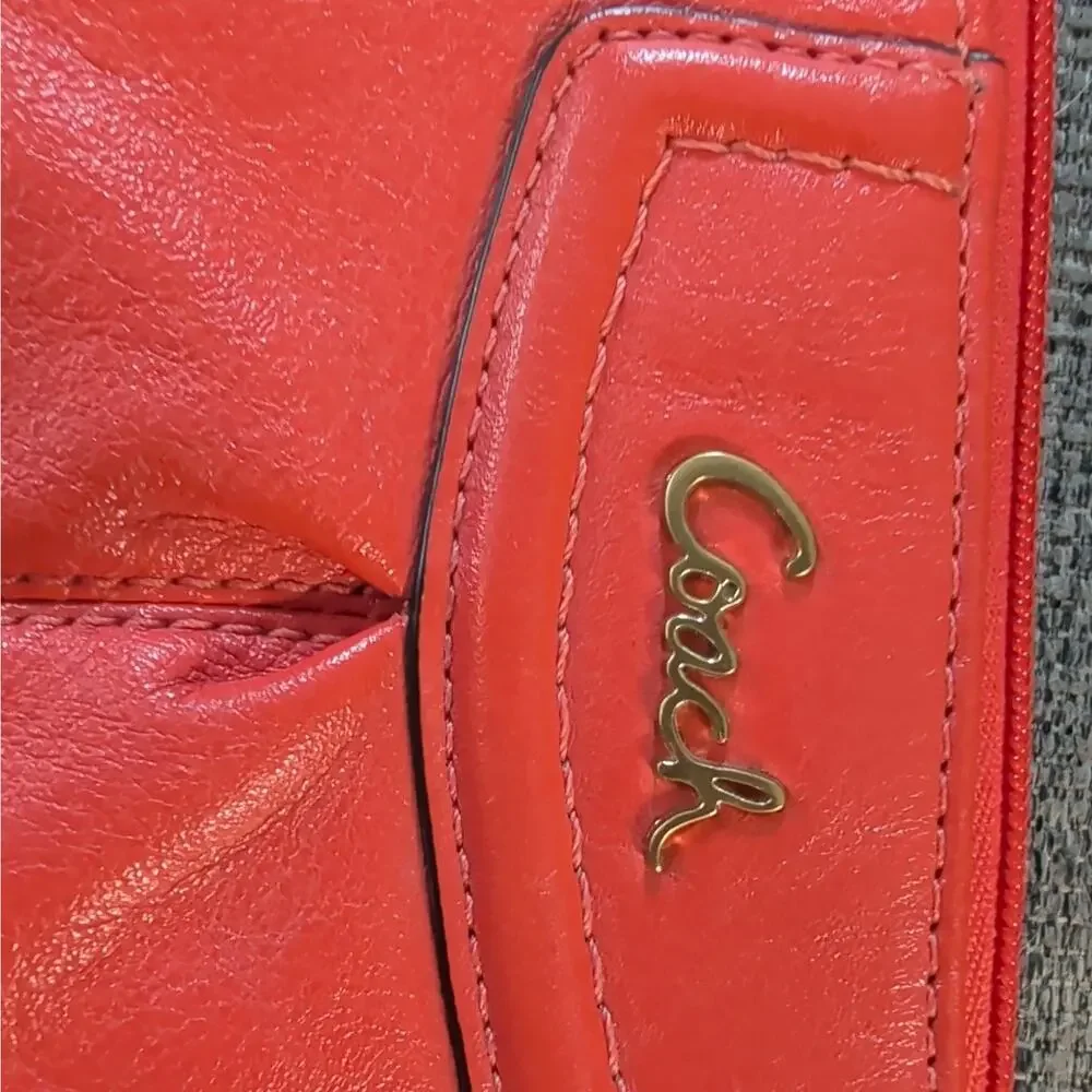 Coach orange wristlet