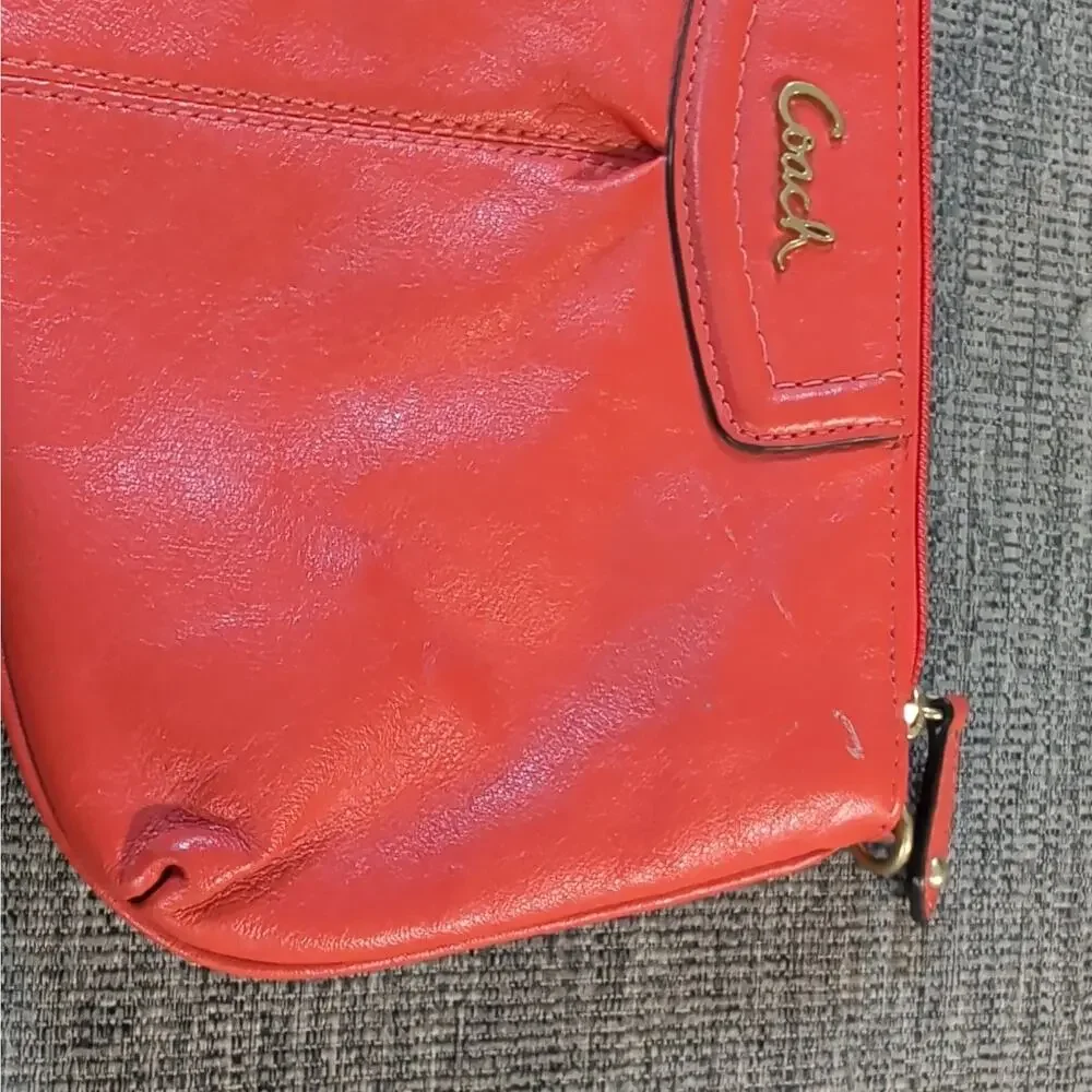 Coach orange wristlet