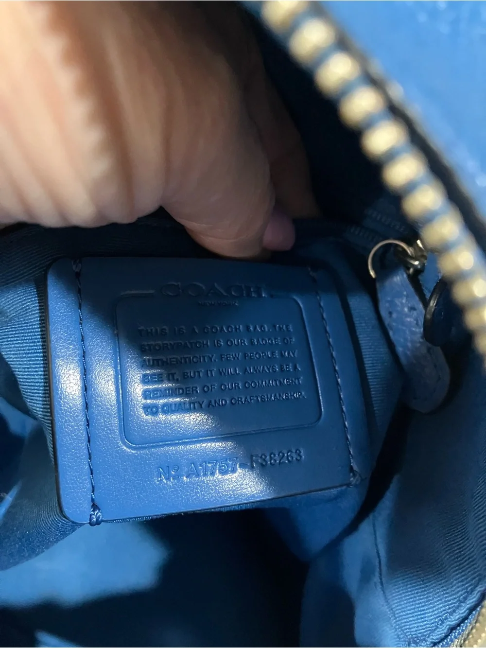 Coach compact pebbled