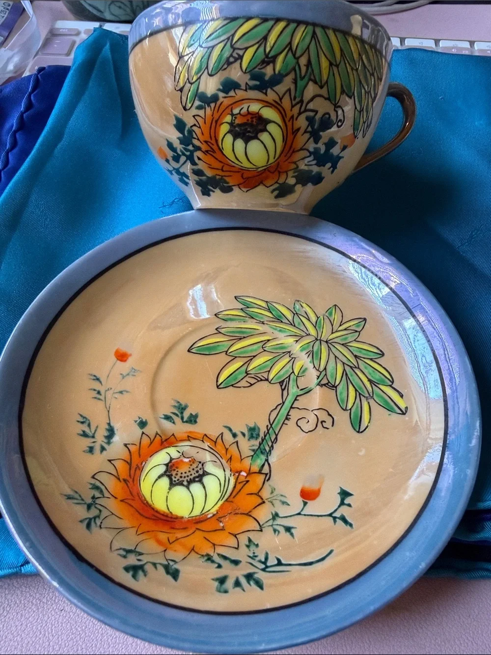 Vintage ca 1940-50’s  made in Japan orange flower lusterware tea cup & saucer