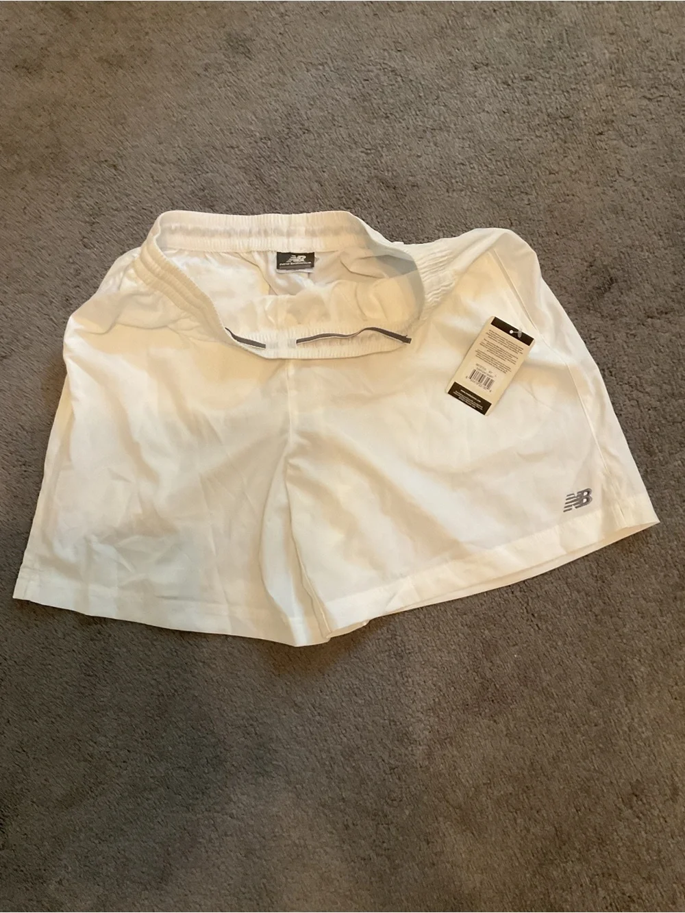 New Balance White Athletic Shorts with Black Logo Tag