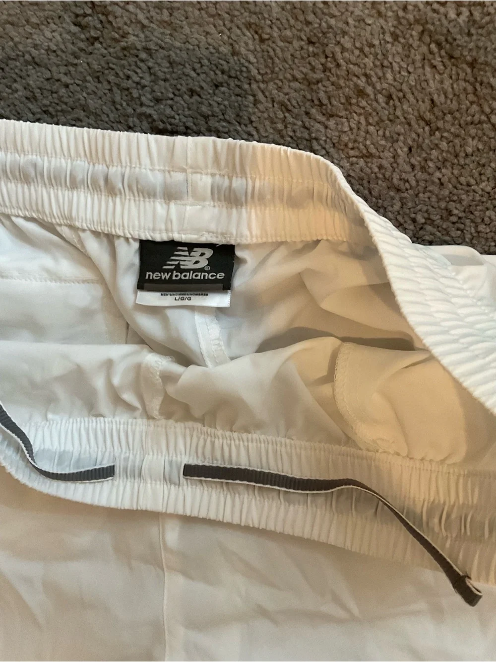 New Balance White Athletic Shorts with Black Logo Tag