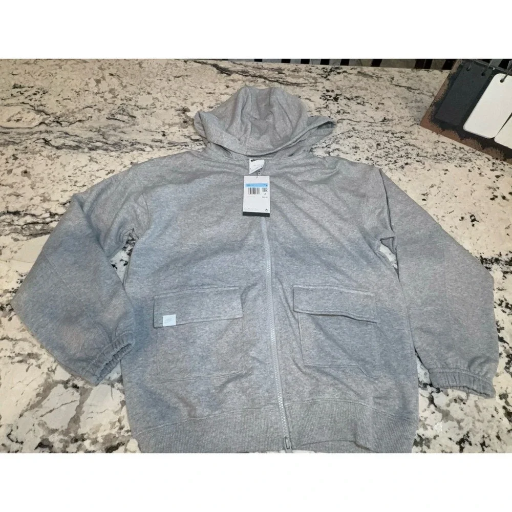 Kids size MEDIUM NIKE oversized fit gray zip up hooded jacket.