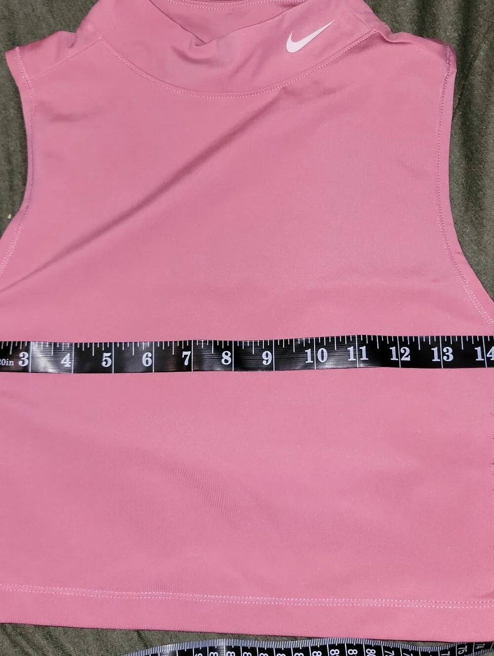 pink Nike Pro Dri-FIT crop top featuring distinctive side-cutout details