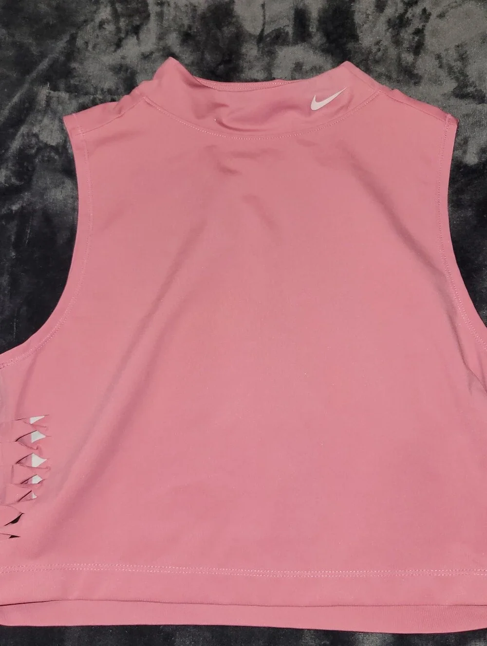 pink Nike Pro Dri-FIT crop top featuring distinctive side-cutout details