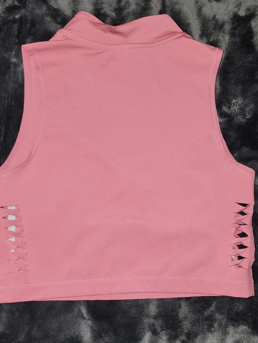 pink Nike Pro Dri-FIT crop top featuring distinctive side-cutout details