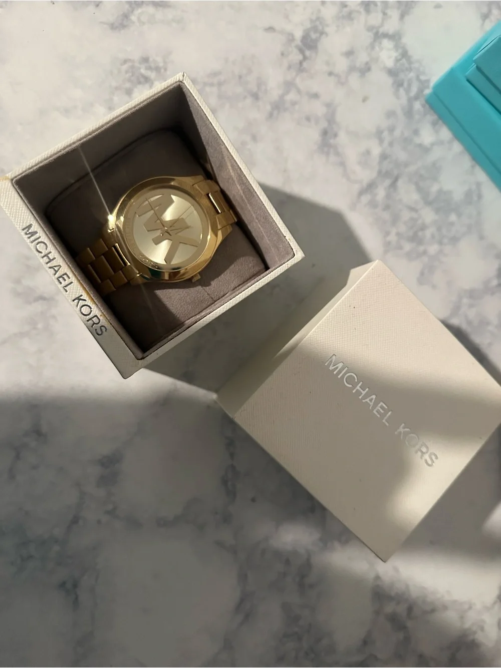 Michael Kors one gold