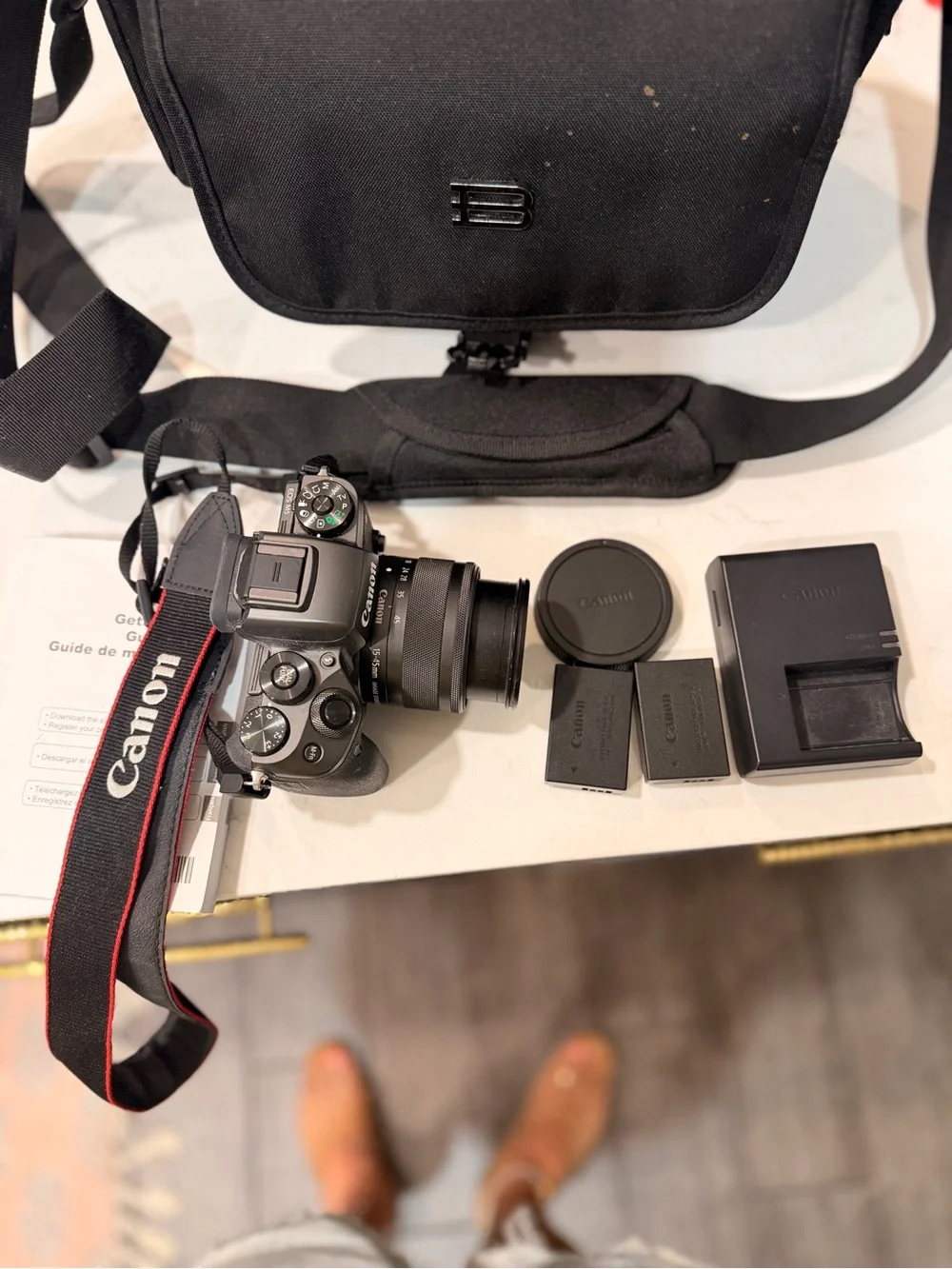 Canon Black Mirrorless Camera with Black Lens and Accessories