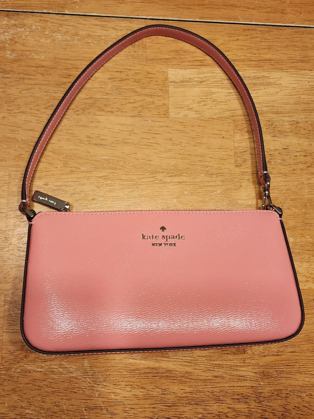 Kate Spade New York Gemini Convertible Wristlet in a pink color