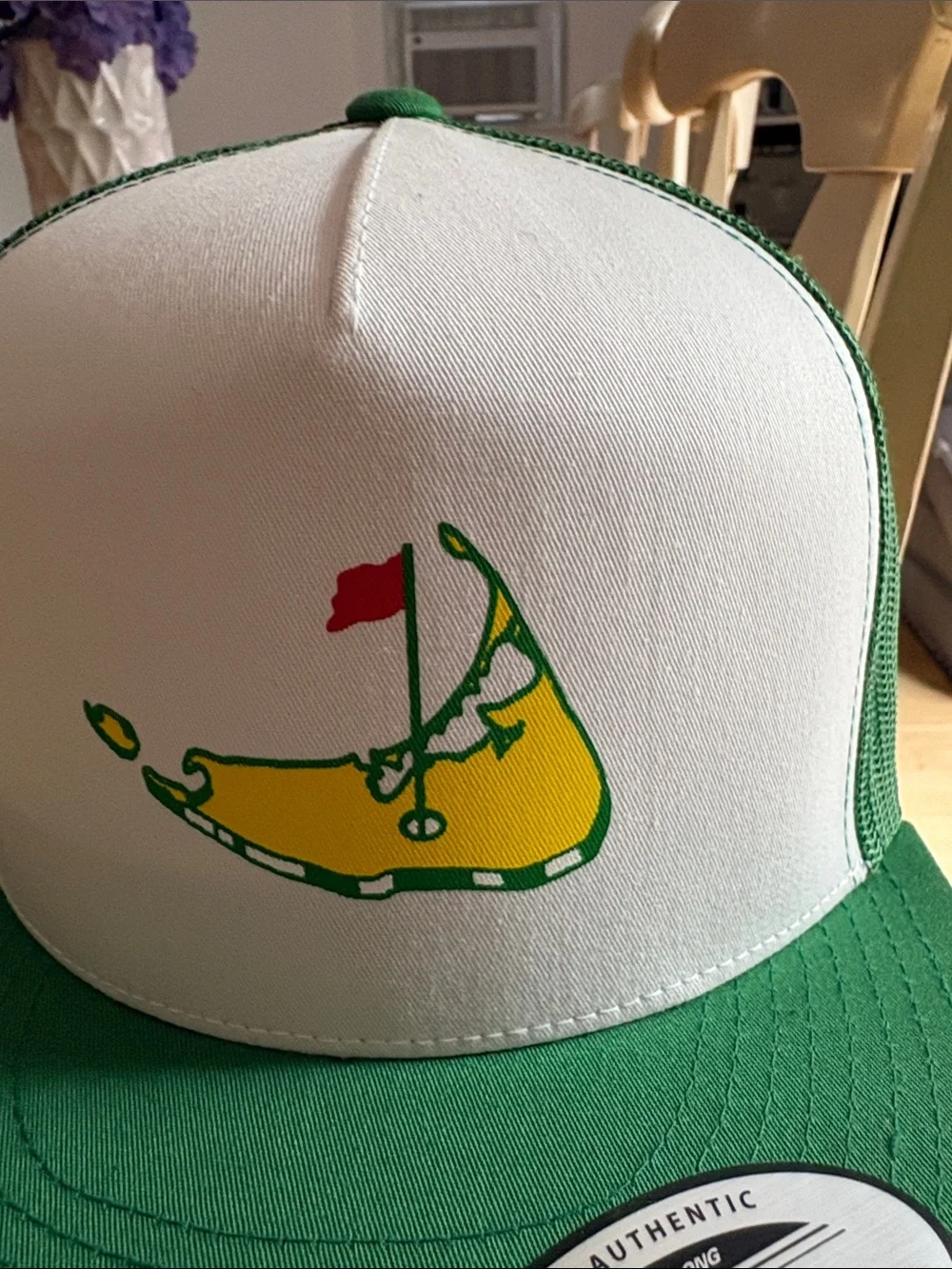 The Classic White and Green Trucker Hat with Nantucket masters Graphic