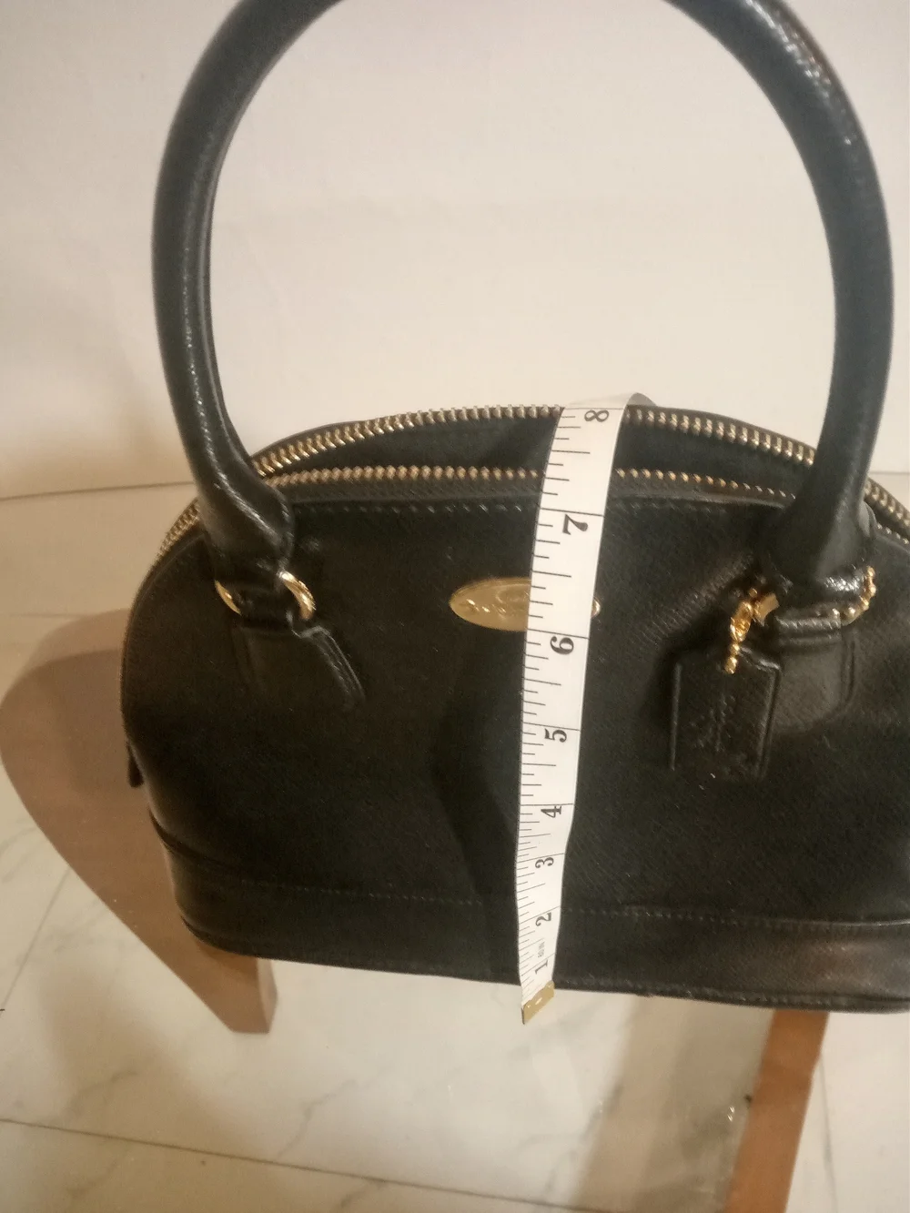Coach looks logo tag