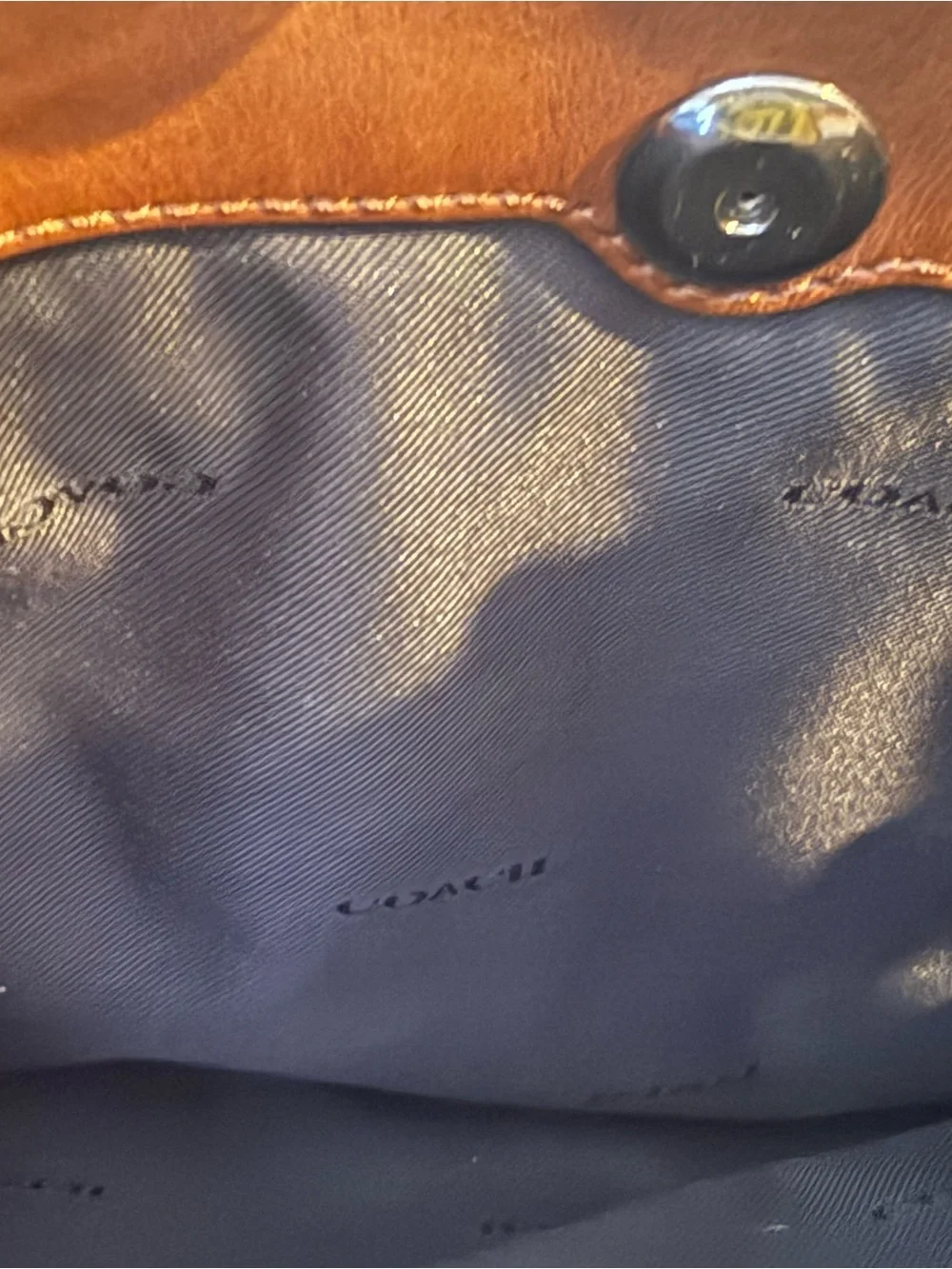 Coach sleek leather