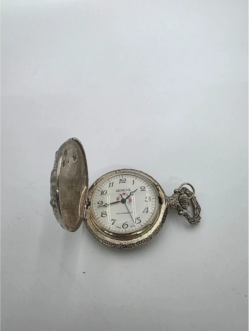 Vintage Geneva Silver Tone Pocket Watch with Ornate Design