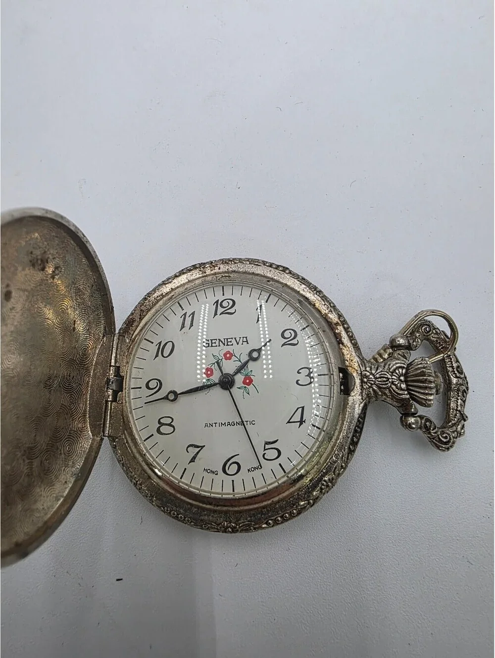 Vintage Geneva Silver Tone Pocket Watch with Ornate Design