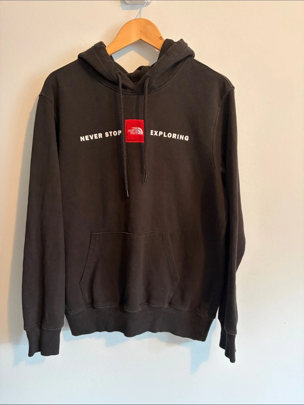 The North Face Black Hoodie with Red Logo - Never Stop Exploring