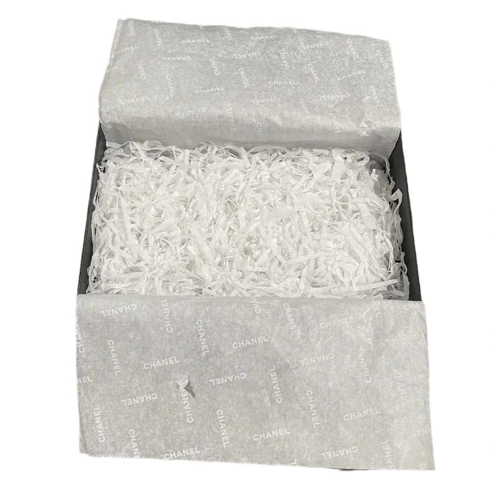 CHANEL tears paper