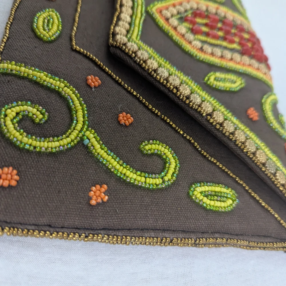 Coomi vibrant clutch