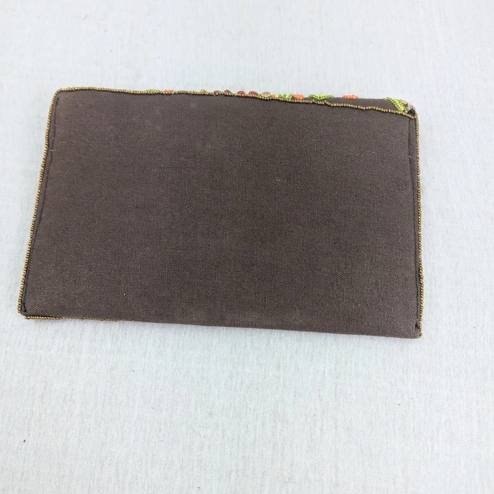 Coomi vibrant clutch